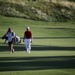 
              Austin Cook, right, and his caddie walk down the ninth fairway during the second round of the St. Jude Classic golf tournament Friday, June 12, 2015, in Memphis, Tenn. (AP Photo/Mark Humphrey)
            
