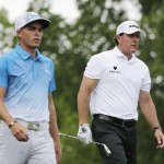 
              Phil Mickelson, right, eyes his tee shot on the third hole as he walks with Rickie Fowler during the first round of the Memorial golf tournament, Thursday, June 4, 2015, in Dublin, Ohio. (AP Photo/Darron Cummings)
            