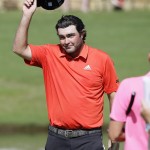 
              Steven Bowditch takes off his cap after finishing the final round of the Byron Nelson golf tournament, Sunday, May 31, 2015, in Irving, Texas. Bowditch won the tournament. (AP Photo/LM Otero)
            