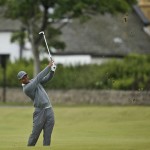 
              United States’ Tiger Woods plays a ball on the third fairway during the first round of the British Open Golf Championship at the Old Course, St. Andrews, Scotland, Thursday, July 16, 2015. (AP Photo/Peter Morrison)
            