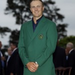 
              FILE - In this April 12, 2015, file photo, Jordan Spieth poses with his green jacket after winning the Masters golf tournament in Augusta, Ga. (AP Photo/David J. Phillip, File)
            