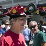 
              Kim Reimer, from Tallahassee, Fla., wears a Ferrari race car hat at during open house at the F1 Canadian Grand Prix auto race, Thursday, June 4, 2015, in Montreal. (Ryan Remiorz/The Canadian Press via AP)
            