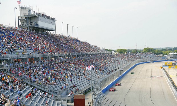 In this July 12, 2015, photo, fans watch the IndyCar Series race at the Milwaukee Mile in West Alli...