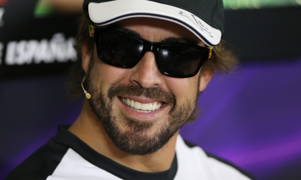 McLaren driver Fernando Alonso of Spain smiles during a press conference at the Barcelona Catalunya...
