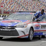 
              Carolina Panthers linebacker Thomas Davis climbs into the pace car at Charlotte Motor Speedway for his certification laps during a news conference in Concord, N.C., Tuesday, May 19, 2015. Davis, the NFL's Man of the Year, has been selected to be the honorary pace car driver for the Coca Cola 600 on Sunday. (AP Photo/Chuck Burton)
            