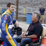 
              Marco Andretti, left, talks with his grandfather and 1969 Indianapolis 500 champion Mario Andretti during practice before qualifications for the Indianapolis 500 auto race at Indianapolis Motor Speedway in Indianapolis, Sunday, May 17, 2015.  (AP Photo/Sam Riche)
            