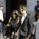 
              Lotus driver Romain Grosjean of France and Marion Jolles arrive at the Sainte Reparate Cathedral to attend the funeral of French Formula One driver Jules Bianchi in Nice, French Riviera, Tuesday, July 21, 2015. Bianchi, 25, died Friday from head injuries sustained in a crash at last year's Japanese Grand Prix. He had been in a coma since the Oct. 5 accident, in which he collided at high speed with a mobile crane which was being used to pick up another crashed car. (AP Photo/Lionel Cironneau)
            