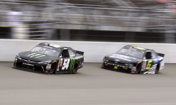Kyle Busch (54) leads Darrell Wallace Jr. (6) during the NASCAR Xfinity series auto race at Michiga...