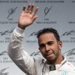 
              Mercedes driver Lewis Hamilton, of Great Britain, waves to the crowd as he take the podium after winning the Canadian Grand Prix Sunday, June 7, 2015 in Montreal.  (Paul Chiasson/The Canadian Press via AP) MANDATORY CREDIT
            