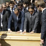 
              Formula one drivers Venezuela's Pastor Maldonado, second left, Brazilian Felipe Massa, second right and French Jean Eric Vergne, stand in front of the casket of French Formula One driver Jules Bianchi into Sainte Reparate Cathedral during his funeral in Nice, French Riviera, Tuesday, July 21, 2015. Bianchi, 25, died Friday from head injuries sustained in a crash at last year's Japanese Grand Prix. He had been in a coma since the Oct. 5 accident, in which he collided at high speed with a mobile crane which was being used to pick up another crashed car. (AP Photo/Lionel Cironneau)
            