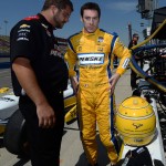 
              Simon Pagenaud, right, from France, speaks with a crew member following the opening practice session, Friday morning, June 26, 2015, for the IndyCar auto race at Auto Club Speedway in Fontana, Calif.  (AP Photo/Will Lester)
            