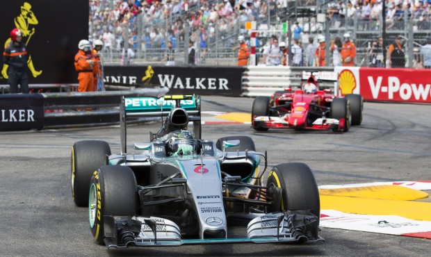 Mercedes driver Nico Rosberg of Germany leads Ferrari driver Sebastian Vettel of Germany during the...