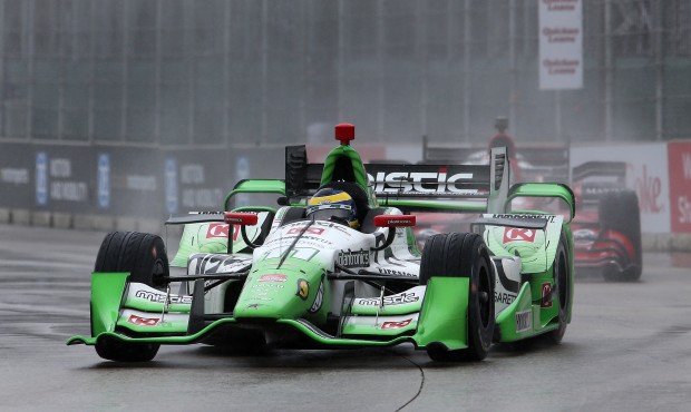 Sebastien Bourdais, of France, drives in the rain during the second race of the IndyCar Detroit Gra...