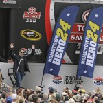 
              Jeff Gordon waves after taking part in a question and answer session with fans before the start of qualifying at the NASCAR Sprint Cup Series auto race Saturday, June 27, 2015, in Sonoma, Calif. (AP Photo/Eric Risberg)
            