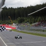 
              Mercedes driver Nico Rosberg of Germany crosses the finish line to win the Austrian Formula One Grand Prix race at the Red Bull Ring in Spielberg, southern Austria, Sunday, June 21, 2015. (Valdrin Xemay, Pool Photo via AP)
            