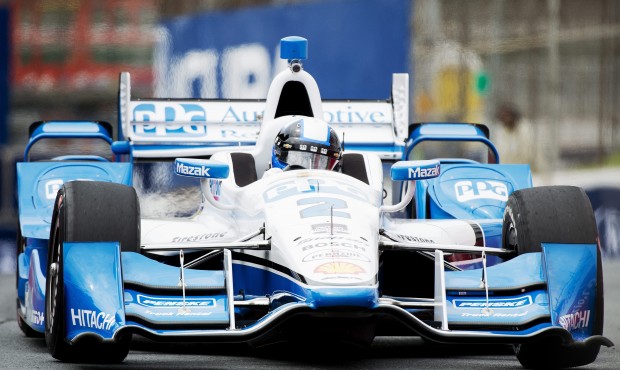 Juan Pablo Montoya, of Colombia, makes a corner during practice for the IndyCar auto race, Friday, ...