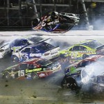 
              Austin Dillon (3) goes airborne and hits the catch fence as he was involved in a multi-car crash on the final lap of the NASCAR Sprint Cup series auto race at Daytona International Speedway, Monday, July 6, 2015, in Daytona Beach, Fla. (AP Photo/Terry Renna)
            