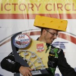 
              Sebastian Bourdais ,. of France, wears a cheese head hat and gets the winners trophy after the IndyCar Series race at the Milwaukee Mile in West Allis, Wis., Sunday, July 12, 2015.  (AP Photo/Jeffrey Phelps)
            