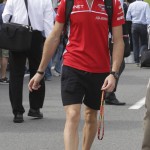 
              In this photo taken on Oct. 4, 2014, Marussia driver Jules Bianchi of France arrives at the paddock of the Suzuka Circuit in Suzuka, central Japan, ahead of the Japanese Formula One Grand Prix. His family says Bianchi has died from head injuries sustained in a crash at the Japanese Grand Prix. The news was posted on Bianchi's official Twitter feed early Saturday morning, July 18, 2015 French time and later confirmed by the Manor F1 team. Bianchi, 25, had been in a coma since the Oct. 5 accident, in which he collided at high speed with a mobile crane which was being used to pick up another crashed car. (AP Photo/Toru Takahashi)
            