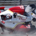 
              The car driven by Helio Castroneves, of Brazil, lands on the track after flipping after hitting the wall in the first turn during practice for the Indianapolis 500 auto race at Indianapolis Motor Speedway in Indianapolis, Wednesday, May 13, 2015. (AP Photo/Tom Hemmer)
            