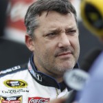 
              FILE - In this Friday, June 5, 2015, file photo, Tony Stewart listens to a question in the garage area while waiting for his back-up car after hitting the wall at Pocono Raceway during practice for the NASCAR Sprint Cup Series auto race in Long Pond, Pa. Stewart is still winless during a trying 2015 season. (AP Photo/Mel Evans, File
            