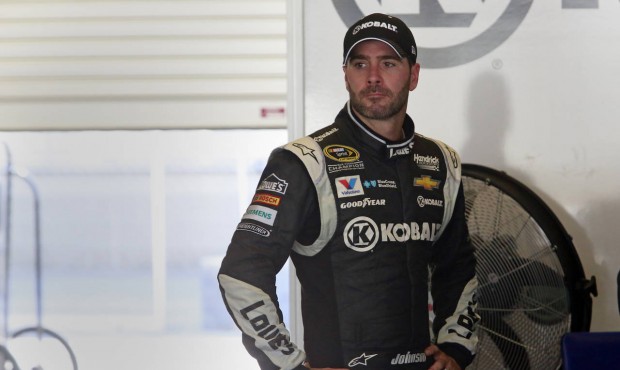 Sprint Cup Series driver Jimmie Johnson (48) waits in his garage during practice for the NASCAR Bri...