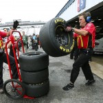 
              Diver Jamie McMurray's crew handles spent tires removed from his car during practice for Sunday's NASCAR Sprint Cup series auto race at New Hampshire Motor Speedway, in Loudon, N.H., Saturday, July 18, 2015  (AP Photo/Cheryl Senter)
            