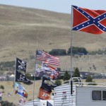 
              A number of flags, including a Confederate-themed one,  fly atop RV's in a campground outside the track during practice for the NASCAR Sprint Cup Series auto race Friday, June 26, 2015, in Sonoma, Calif. (AP Photo/Eric Risberg)
            