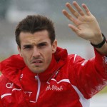 
              FILE - In this Oct. 5, 2014 file photo, Marussia driver Jules Bianchi of France waves during drivers' parade before the Japanese Formula One Grand Prix at the Suzuka Circuit in Suzuka, central Japan. His family says Bianchi has died from head injuries sustained in a crash at the Japanese Grand Prix. The news was posted on Bianchi's official Twitter feed early Saturday morning, July 18, 2015 French time and later confirmed by the Manor F1 team. Bianchi, 25, had been in a coma since the Oct. 5 accident, in which he collided at high speed with a mobile crane which was being used to pick up another crashed car. (AP Photo/Shizuo Kambayashi, File)
            