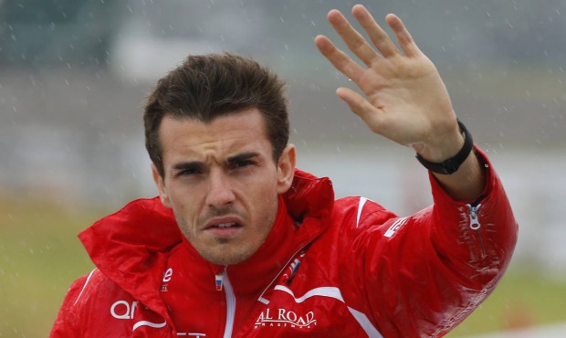 FILE – In this Oct. 5, 2014 file photo, Marussia driver Jules Bianchi of France waves during ...