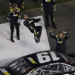 
              Carl Edwards does a back flip from his car after winning the NASCAR Sprint Cup series auto race at Charlotte Motor Speedway in Concord, N.C., Sunday, May 24, 2015. (AP Photo/Gerry Broome)
            