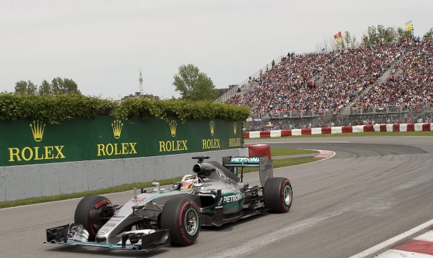 Mercedes driver Lewis Hamilton, of Great Britain, drives through the Senna corner as he leads the e...