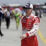 
              Kevin Harvick walks through the garage before practice for Sunday's NASCAR Coca-Cola 600 Sprint Cup series auto race at Charlotte Motor Speedway in Concord, N.C., Thursday, May 21, 2015. (AP Photo/Chuck Burton)
            