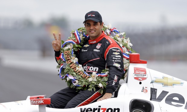 Juan Pablo Montoya, of Colombia, poses in his car during the traditional winners photo session at I...