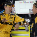 
              Matt Kesenth, left, talks to a crew member during practice for Sunday's NASCAR Sprint Cup series auto race at Charlotte Motor Speedway, Saturday, May 23, 2015, in Concord, N.C. (AP Photo/Terry Renna)
            