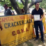 
              In this photo taken Saturday, June 20, 2015, NASCAR driver Jeff Gordon is presented with a certificate of appreciation for a financial donation he made several years ago to help keep the Roy Hayer Memorial Speedway open in Rio Linda, Calif. Gordon began his career at the quarter-midget dirt track when he was 5 and the track was called Cracker Jack Track. (AP Photo/Jenna Fryer)
            