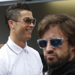 
              Soccer star player Cristiano Ronaldo, left, and McLaren driver Fernando Alonso, of Spain, attend a photo call at the McLaren pits prior to the start of the Formula One Grand Prix, at the Monaco racetrack, in Monaco, Sunday, May 24, 2015. (AP Photo/Luca Bruno)
            