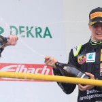 
              German Formula 4 driver Mick Schumacher of Van Amersfoort sprays champagne after receiving the best rookie award during the season kickoff in Oschersleben, Germany, Saturday, April 25, 2015, after ranking 9th in the race. He is the son of former Formula One World Champion Michael Schumacher. (Jens Wolf/dpa via AP)
            