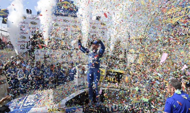 Jimmie Johnson celebrates in Victory Lane after he won the NASCAR Sprint Cup series auto race, Sund...