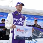
              Denny Hamlin poses with the pole award after he won the position for Sunday's NASCAR Sprint Cup series auto race, Friday, May 29, 2015, at Dover International Speedway in Dover, Del. (AP Photo/Nick Wass)
            