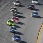
              Winner Dale Earnhardt Jr., front, leads Jimmie Johnson through the tri-oval and toward the finish line during the Talladega 500 NASCAR Sprint Cup Series auto race at Talladega Superspeedway, Sunday, May 3, 2015, in Talladega, Ala. (AP Photo/Butch Dill)
            