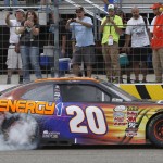 
              Denny Hamlin burns out before fans after winning the NASCAR XFINITY Cup series Lakes Region 200 at New Hampshire Motor Speedway Saturday, July 18, 2015, in Loudon, N.H. (AP Photo/Jim Cole)
            