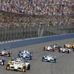 
              Simon Pagenaud (22), from France, leads the field toward Turn 1 on Saturday June 27, 2015, on the opening lap of the IndyCar auto race at Auto Club Speedway in Fontana, Calif. (AP Photo/Will Lester)
            