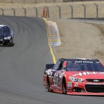 
              Kurt Busch, right, and Landon Cassill, left, drive through Turn 8 during practice for the NASCAR Sprint Cup Series auto race Friday, June 26, 2015, in Sonoma, Calif. (AP Photo/Eric Risberg)
            