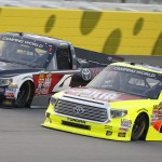 
              NASCAR drivers Erik Jones (4) and Matt Crafton (88) race side-by-side during a Truck Series auto race at Kansas Speedway in Kansas City, Kan., Friday, May 8, 2015. (AP Photo/Colin E. Braley)
            