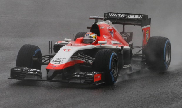 FILE – In this Oct. 5, 2014 file photo, Marussia driver Jules Bianchi of France steers his ca...