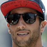
              Australian Daniel Ricciardo of Infiniti Red Bull with an inscription on his cap referring to the late French Formula One pilot Jules Bianchi arrives for the Formula One Hungarian Grand Prix on the Hungaroring circuit in Mogyorod, 23 kms north-east of Budapest, Hungary, Thursday July 23, 2015. The 2015 Formula One Grand Prix of Hungary will take place on Sunday, July 27. (Tamas Kovacs/MTI via AP)
            