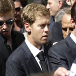 
              German Formula One driver Sebastian Vettel attends the funeral of French Formula One driver Jules Bianchi at the Sainte Reparate Cathedral during in Nice, French Riviera, Tuesday, July 21, 2015. Bianchi, 25, died Friday from head injuries sustained in a crash at last year's Japanese Grand Prix. He had been in a coma since the Oct. 5 accident, in which he collided at high speed with a mobile crane which was being used to pick up another crashed car. (AP Photo/Lionel Cironneau)
            