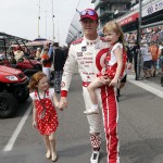 
              Scott Dixon, of New Zealand, walks with daughters Poppy, 5, left, and Tilly, 3, after qualifying for the Indianapolis 500 auto race at Indianapolis Motor Speedway in Indianapolis, Sunday, May 17, 2015. (AP Photo/Sam Riche)
            