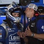 
              Jimmie Johnson, left, listens to his crew chief Chad Knaus, right, during practice for Sunday's NASCAR Sprint Cup series auto race, Saturday, May 30, 2015, at Dover International Speedway in Dover, Del. (AP Photo/Nick Wass)
            